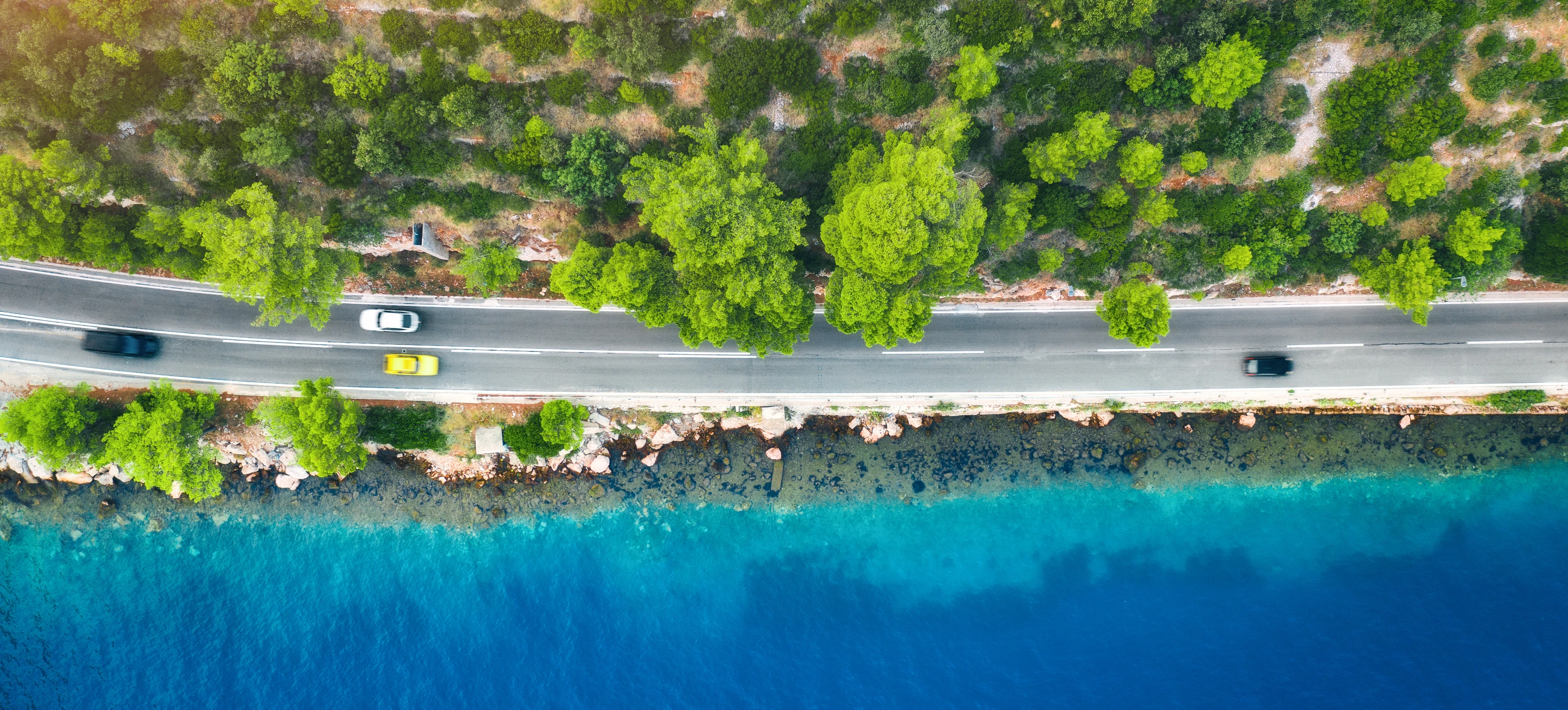 Aerial coastal road beside the sea